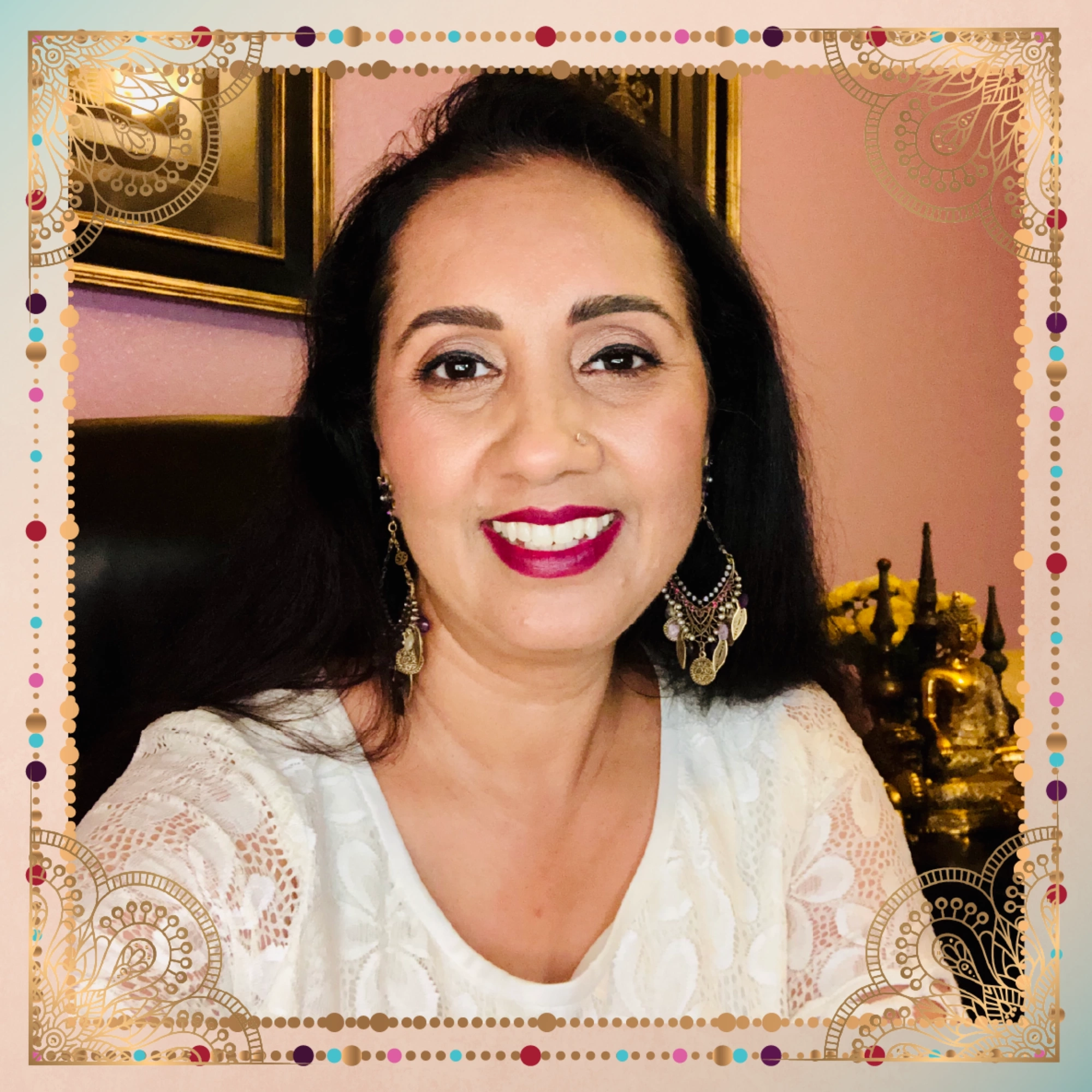An Indian woman smiling in front of a frame at a bootcamp. An Indian woman smiling in front of a frame at a bootcamp.